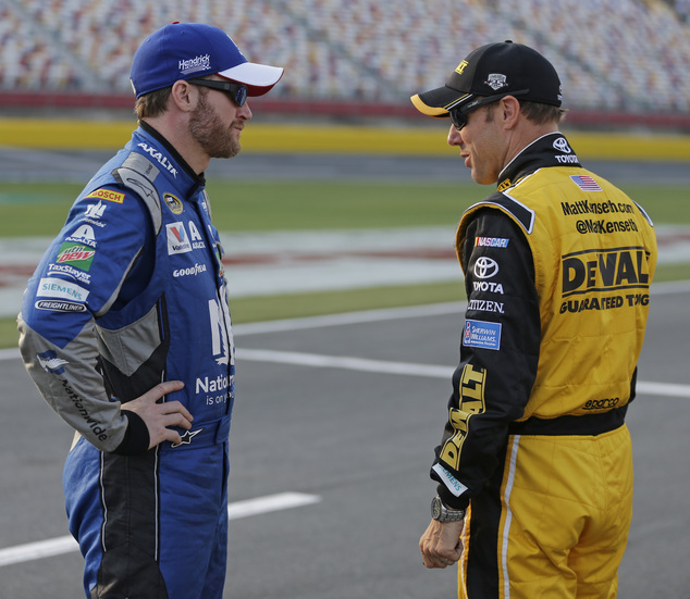 Dale Earnhardt Jr left talks with Matt Kenseth before qualifying for Sunday's NASCAR Sprint Cup series auto race at Charlotte Motor Speedway in Concord N