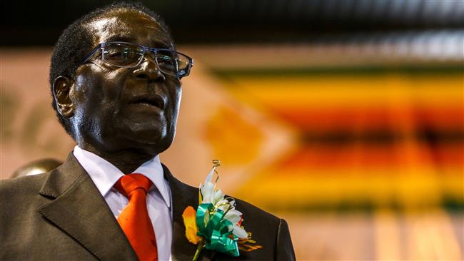 Zimbabwe’s President Robert Mugabe attends a meeting with the country’s National Liberation War Veterans Association