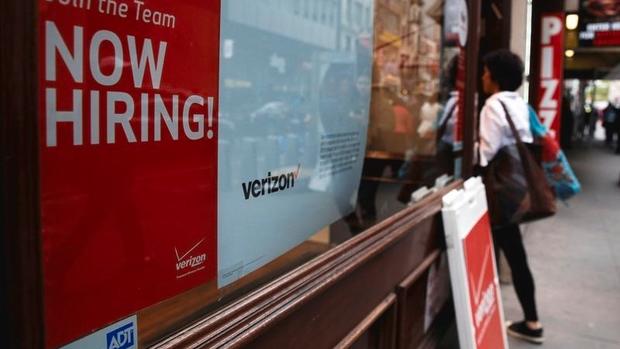 A'Now Hiring sign is posted on a Verizon store in Manhattan in New York City U.S