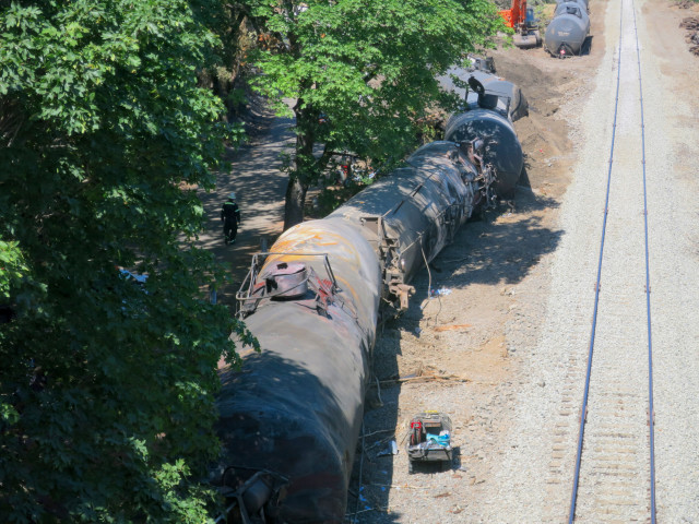 A 16-car oil train derailment caused a fire and left a small oil sheen on the Columbia River