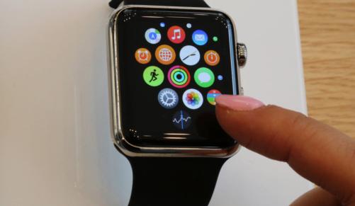 A customer demonstrates the Apple Watch at an Apple store in Tokyo. File