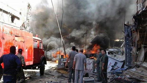 A fire burns after the attack in Sayyida Zeinab Damascus