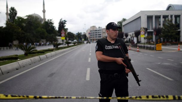 A police officer stands near the explosion site in Istanbul Tuesday