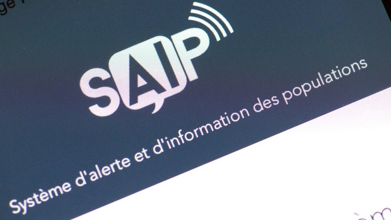 A smartphone with the logo of the SAIP app which will alert users if there is a terror attack