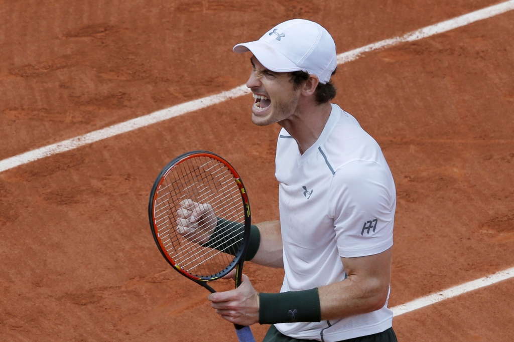 Andy Murray celebrates reaching the fourth round