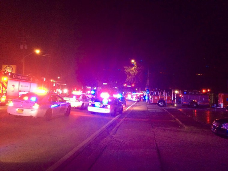 Police cars and fire trucks are seen outside the Pulse night club where police said a suspected gunman left multiple people dead and injured in Orlando Florida June 12