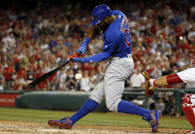 Chicago Cubs&#39 Jason Heyward swings at a pitch for the third strike and final out in the team's baseball game against the Washington Nationals at Nationals Park Monday