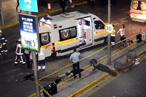 Ambulances begin to deal with the dead and wounded at the Istanbul airport as security forces mop up the remaining terrorist threat