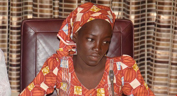 Amina Ali sits during a meeting with Nigeria's President Muhammadu Buhari at the Presidential palace in Abuja Nigeria