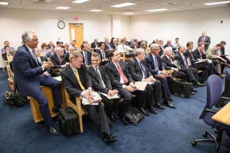 Aram Boghosian for the Boston Globe		Twenty-two attorneys lined the benches during a hearing