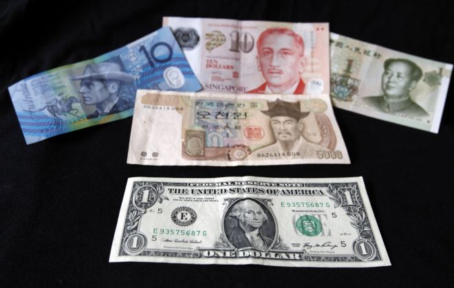 Asian currencies drop on Yellen comments