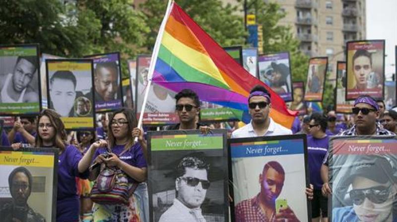 At gay pride parades, a mix of celebration and sorrow