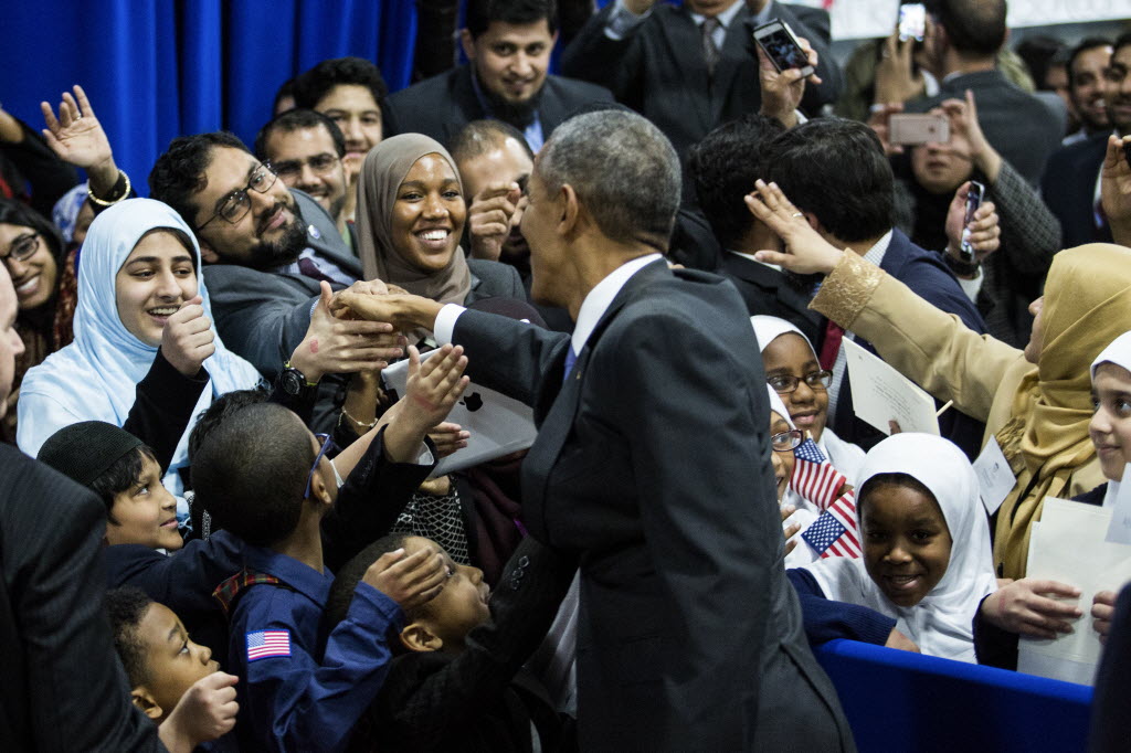 President Barack Obama greets attendees in an overflow room after after speaking at the Islamic Society of Baltimore in Maryland Feb. 3 2016