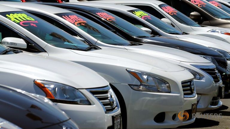 Automobiles are shown for sale at a car dealership in Carlsbad California