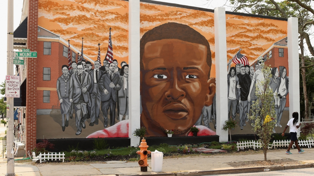 A mural memorializing Baltimore resident Freddie Gray adorns a wall near the place where he was tackled and arrested by police. The Baltimore Sun says it has acquired a copy of the unreleased government autopsy report in the case