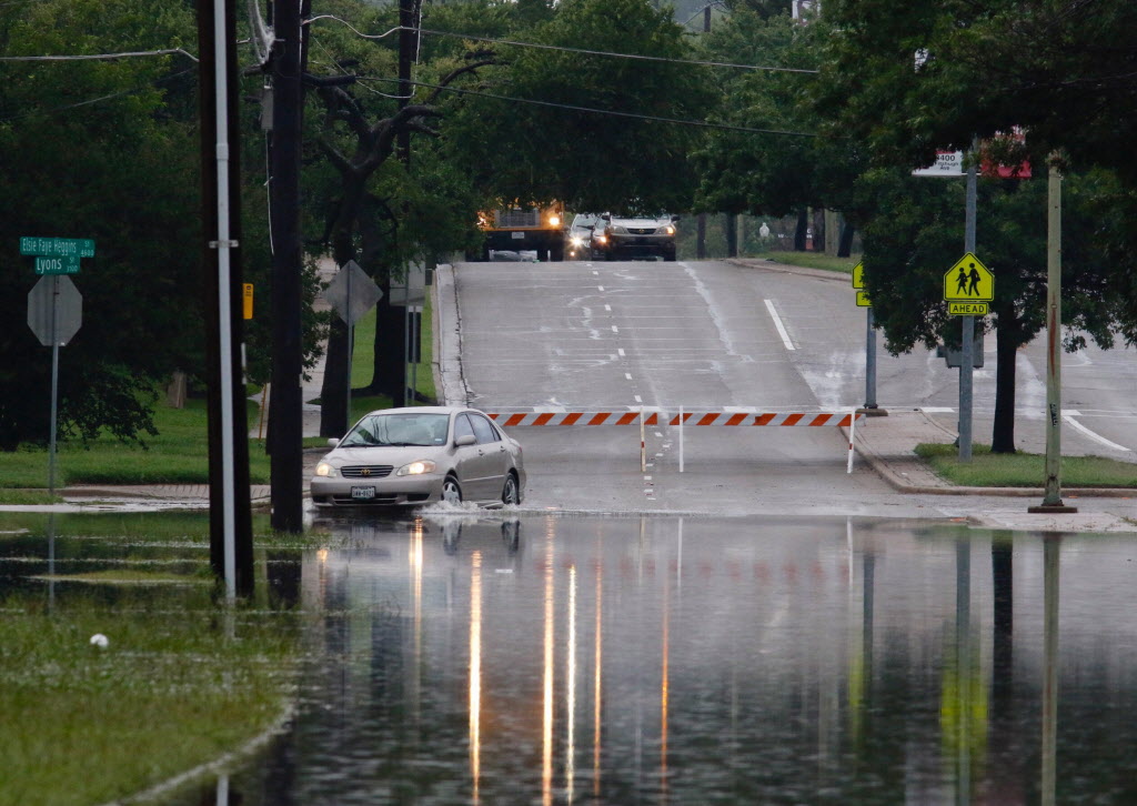 Barricades blocked the intersection of Lyons and Elsie Faye Heggins streets in South Dallas on Thursday morning