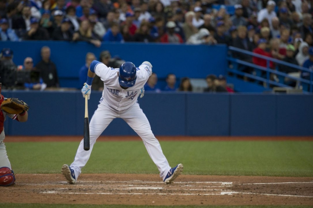 Toronto Blue Jays Jose Bautista performs some acrobatics to avoid being hit in the fifth inning Monday. Bautista was playing for the first time since Thursday