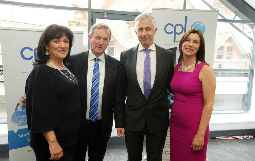 Taoiseach in'hands across the border business plea