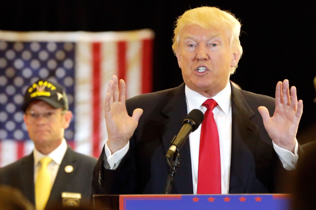 NatWorld0531a370-1 Republican presidential candidate Donald Trump answers questions Tuesday at a news conference in New York