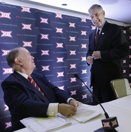 Big 12 Commissioner Bob Bowlsby right and University of Oklahoma President David Boren smile after speaking to reporters at the Big 12 sports conference meetings in Irving Texas Thursday