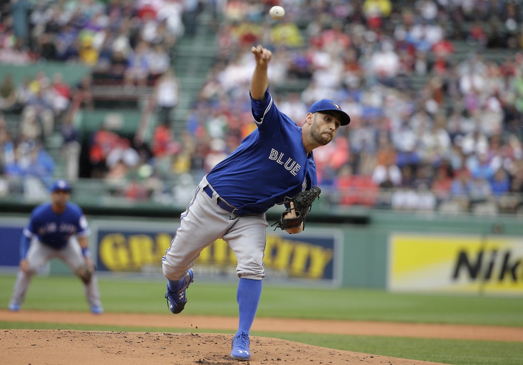 Toronto Blue Jays&apos Marco Estrada delivers a pitch against the Boston Red Sox in the first inning of a baseball game Sunday