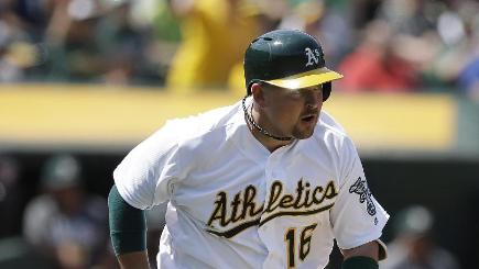 Oakland Athletics&#39 Billy Butler runs to first base after hitting a two-run single