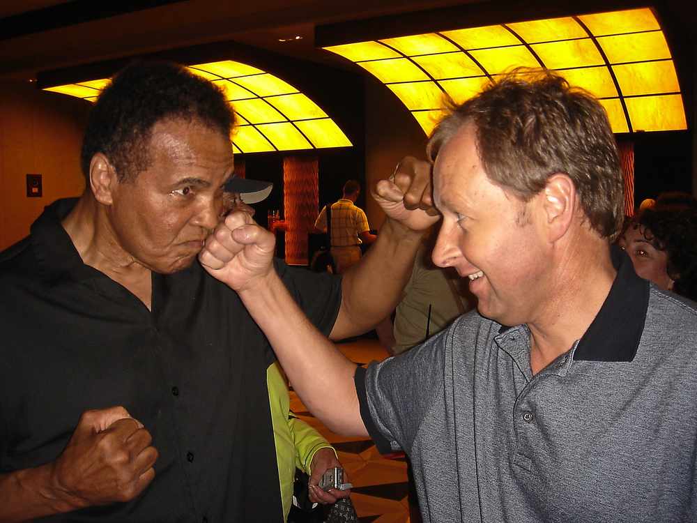 Boxing legend Muhammad Ali takes a right hook for the camera from Paul Rushworth of Shrewsbury