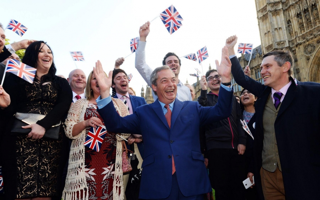 Nigel Farage the leader of the U.K. Independence Party celebrates with his supporters in London on Friday. Britain voted to leave the European Union after a bitterly divisive referendum campaign according to tallies of official results