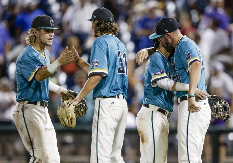 Nati Harnik  Associated Press Coastal Carolina's Zach Remillard Bobby Holmes, Michael Paez and Mike Morrison right celebrate their 7-5 win over TCU in the College World Series semifinals Saturday