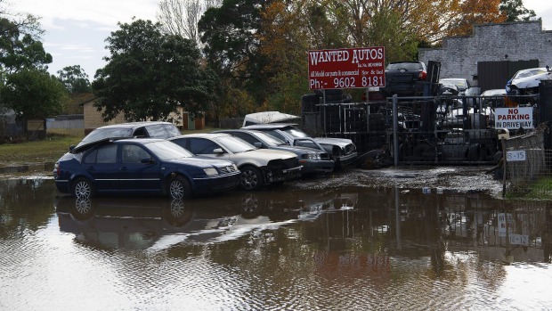 Cars trapped in floodwaters on Newbridge Road Milperra