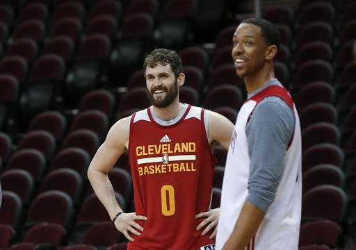 Cleveland Cavaliers forward Kevin Love smiles with Channing Frye during practice for Game 4 of basketball's NBA Finals against the Golden State Warriors in Cleveland Thursday