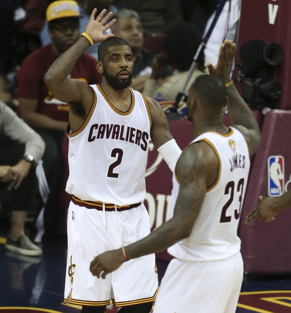 Kyrie Irving left and Le Bron James of the Cavaliers celebrate their 120-90 win against the Warriors in Game 3 of the NBA Finals on Wednesday. The two stars promised to pick up the slack for ailing teammate Kevin Love out with a concussion