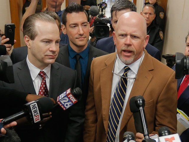 David Daleiden center one of the two anti-abortion activists indicted last week addresses the media with attorney's Jared Woodfill left and Terry Yates after turning himself in to authorities Thursday Feb. 4 2016 in Houston. Daleiden and Sand