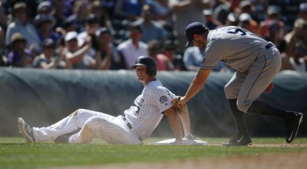 Colorado Rockies DJ LeMahieu left slides safely into