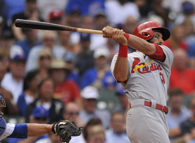 St. Louis Cardinals Matt Carpenter watches his two-run double during the sixth inning of a baseball game against the Chicago Cubs Wednesday