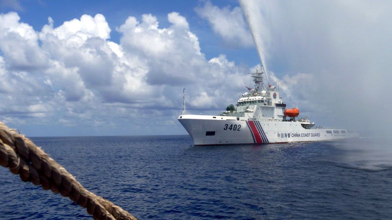 A CHINESE Coast Guard ship approaches Filipino fishermen off Panatag Shoal in the West Philippine Sea in this