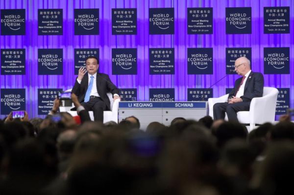 Chinese Premier Li Keqiang left answers a question