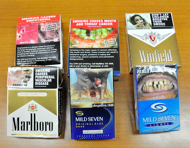 Cigarette packages sold abroad carry graphic warnings against smoking