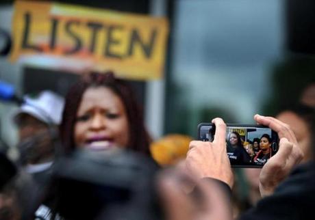 President Nekima Levy-Pounds center as she speaks against police brutality during a press conference following U.S. Attorney Andrew Luger's announcement that no criminal civil rights charges