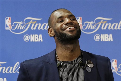 Cleveland Cavaliers forward Le Bron James smiles at a news conference after Game 5 of basketball's NBA Finals between the Golden State Warriors and the Cavaliers in Oakland Calif. Monday