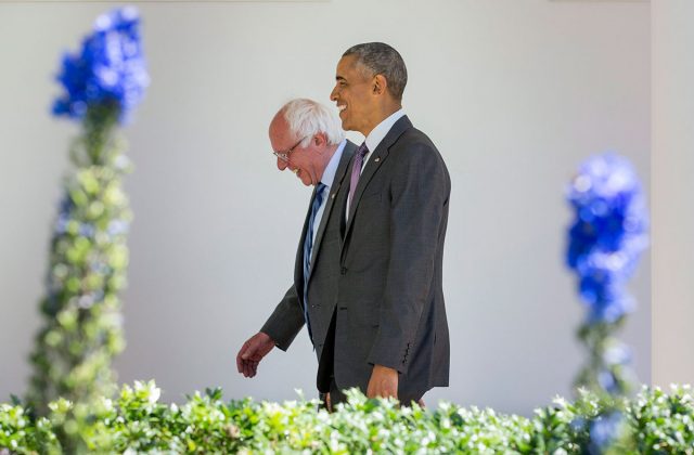 US President Barack Obama walks with Democratic presidential candidate Bernie Sanders down the Colonnade during their meeting at the White House in Washington on Thursday