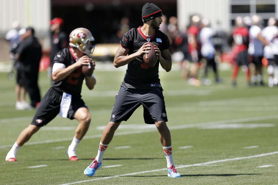 From left quarterbacks Blaine Gabbert and Colin Kaepernick get in some throws during the first day of the 49ers’ three-day minicamp