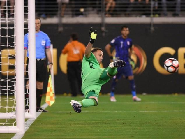 Colombia goalkeeper David Ospina stops a penalty shot by Peru’s Miguel Trauco during the Copa America quarterfinal in East Rutherford New Jersey on Friday