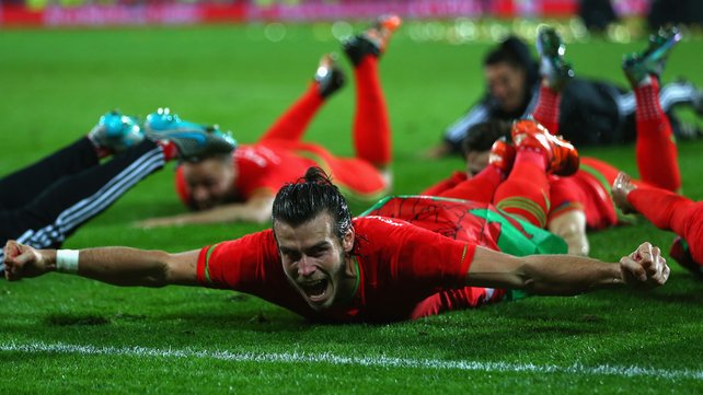 Bales leads the celebrations after Wales secured their place at Euro 2016 in France