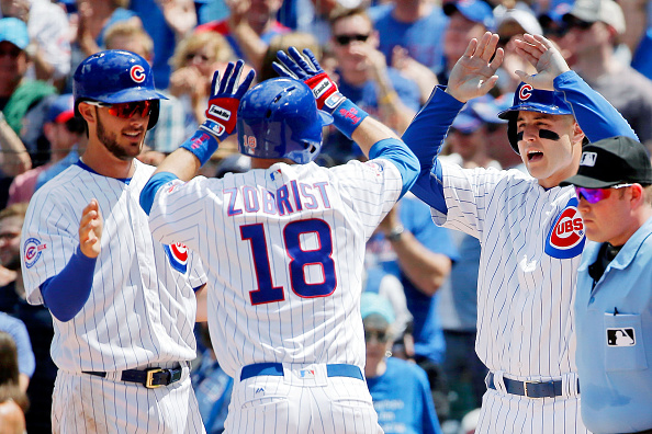 CHICAGO IL- MAY 29 Kris Bryant #17 of the Chicago Cubs and Anthony Rizzo #44 congratulate Ben Zobrist #18 on hitting a three run home run against the Philadelphia Phillies during the third inning at Wrigley Field