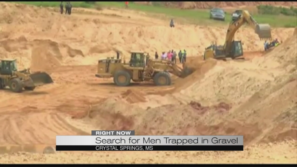 2 missing after becoming buried in Mississippi gravel pit