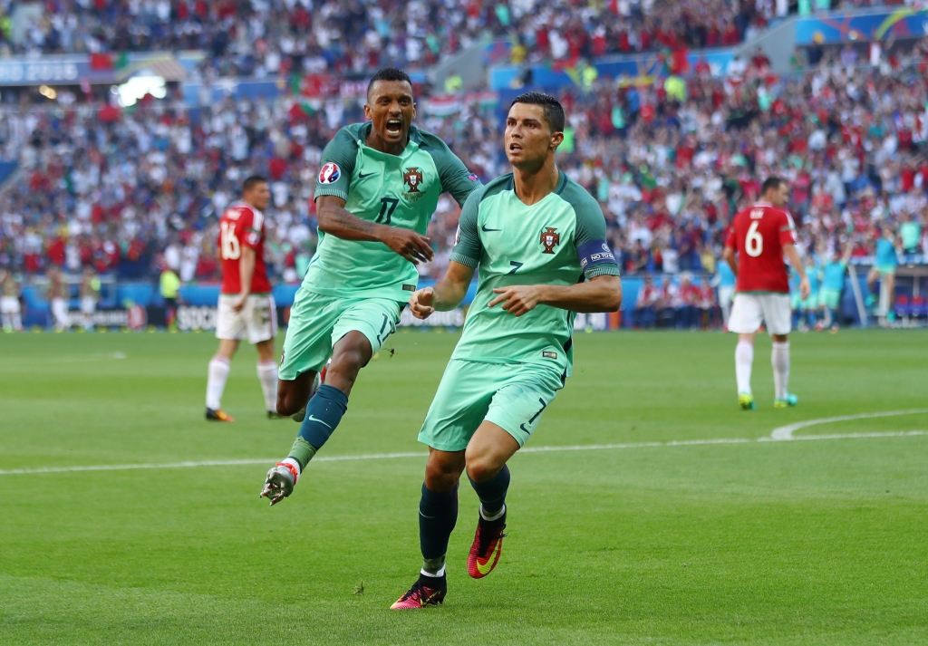 LYON FRANCE- JUNE 22 Cristiano Ronaldo of Portugal celebrates scoring his team's second goal with his team mate Nani during the UEFA EURO 2016 Group F match between Hungary and Portugal at Stade des Lumieres