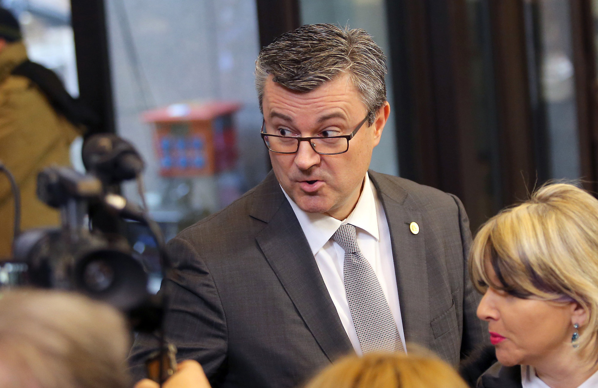 Croatian Prime Minister Tihomir Oreskovic speaks with journalists as he arrives for an EU summit in Brussels. Croatian lawmakers were debating on Thursday