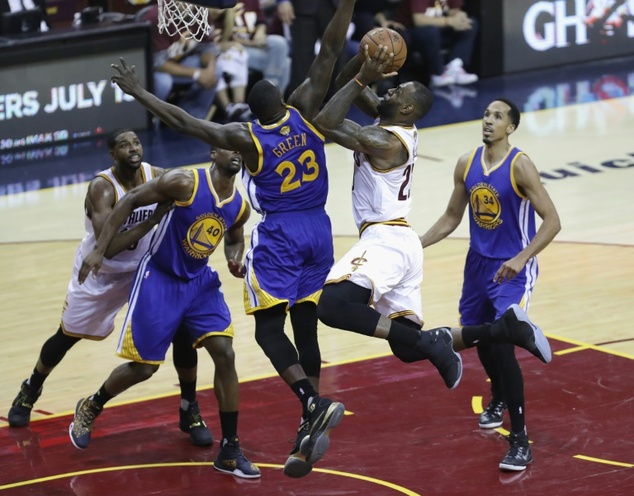 LeBron James of the Cleveland Cavaliers drives to the basket against Draymond Green of the Golden State Warriors during Game 3 of their 2016 NBA Finals at Q