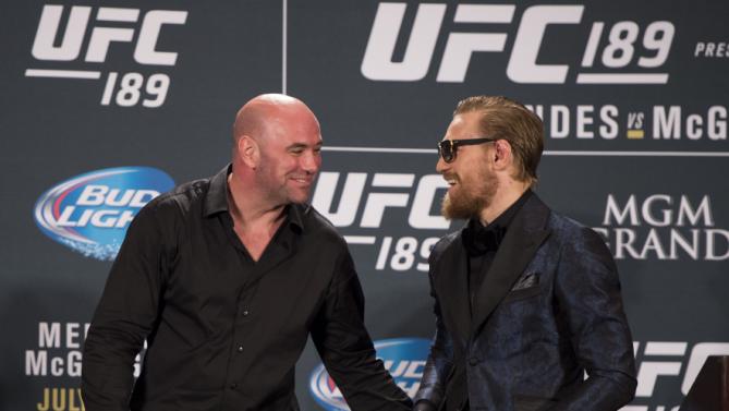 LAS VEGAS NV- JULY 11 UFC President Dana White and UFC interim featherweight champion Conor Mc Gregor interact during the UFC 189 post fight press conference at the MGM Grand Garden Arena